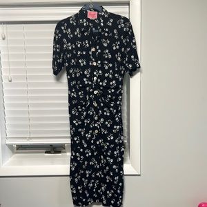 Kate Spade short sleeve dress.  Background is black w ivory flowers.